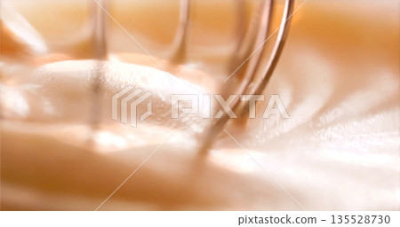 Cream Peaks Formed, Fastmotion Shot Capturing Glossy Foam Of Whipped Cream Forming Around Beaters 135528730