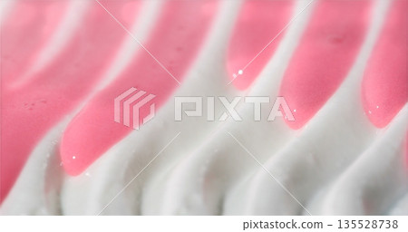Macro Shot Showcasing Creamy Meringue Enveloped In Smooth Pink Glaze With Swirling Decorative Patterns Macro Shot Showcasing Creamy Meringue Enveloped In Smooth Pink Glaze With Swirling Decorative Patterns 135528738