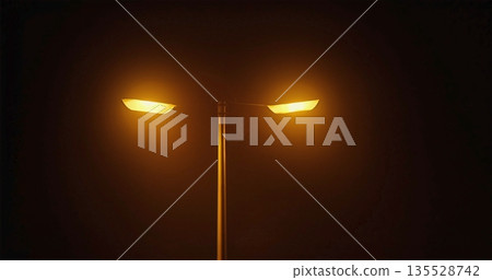 Luminous Foggy Street, Mysterious Scene With Glowing Lamp Amid Silent Foggy City Streets At Night Luminous Foggy Street, Mysterious Scene With Glowing Lamp Amid Silent Foggy City Streets At Night 135528742