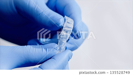 Expert Practitioners Emphasize Hygiene Standards While Carefully Fitting Orthodontic Devices With Precision Expert Practitioners Emphasize Hygiene Standards While Carefully Fitting Orthodontic Devices With Precision 135528749