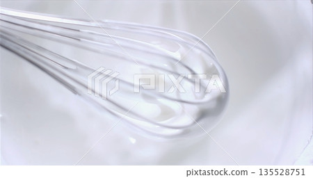 Stainless Wire Beaters Blending, Closeup Of Metal Whisk Gracefully Mixing Smooth Cream In Bowl Stainless Wire Beaters Blending, Closeup Of Metal Whisk Gracefully Mixing Smooth Cream In Bowl 135528751