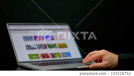Hands Choose Digital Images, Freelancer Engaged With Colorful Thumbnail Gallery On Dimly Lit Workspace Hands Choose Digital Images, Freelancer Engaged With Colorful Thumbnail Gallery On Dimly Lit Workspace 135528752