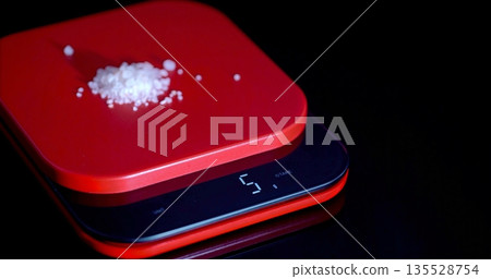 Detailed Shot Of Salt On Scale Illustrating Importance Of Accurate Portion Control For Health Detailed Shot Of Salt On Scale Illustrating Importance Of Accurate Portion Control For Health 135528754