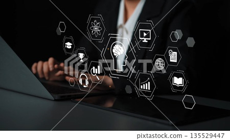 Woman Using Laptop with Virtual Education Icons and AI Symbols on Black Background for Digital Learning and Technology Concepts Gluon 135529447