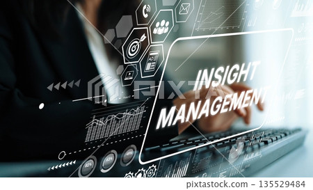 Professional Businesswoman Using Technology for Insight Management in Modern Office Environment. Asymptotic smart data analytic Professional Businesswoman Using Technology for Insight Management in Modern Office Environment. Asymptotic smart data analytic 135529484