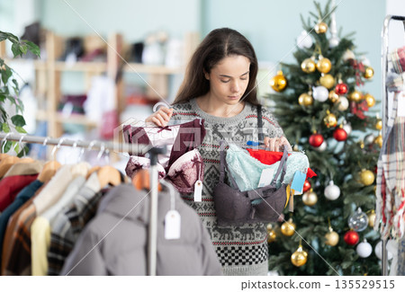 Girl spend time in shop and choose lingerie, X mass shopping 135529515