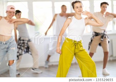 Teenage girl dancing jazz funk in group Teenage girl dancing jazz funk in group 135529655