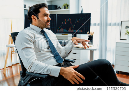 Trader analyzing in dynamic stock exchange investment screen on pc. Surmise. 135529703
