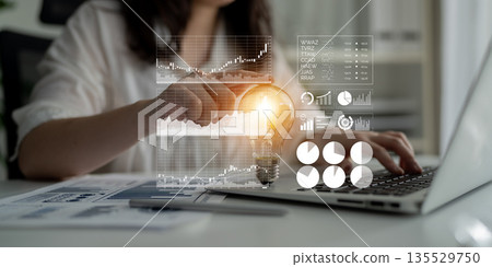 Innovative Business Strategy with Data Visualization and Lightbulb Symbol Representing Ideas and Insights in Modern Office Environment Impute Innovative Business Strategy with Data Visualization and Lightbulb Symbol Representing Ideas and Insights in Modern Office Environment Impute 135529750