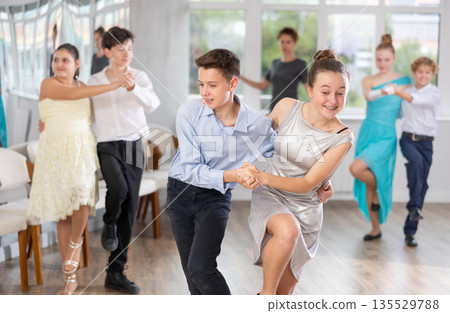 Boy and girl dancing twist in studio 135529788