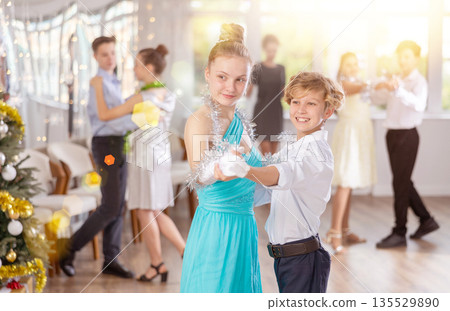 Boy and girl dancing waltz in studio 135529890