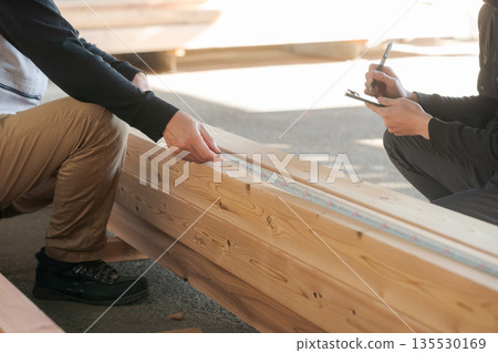 Hands of a man working at a lumber mill Hands of a man working at a lumber mill 135530169