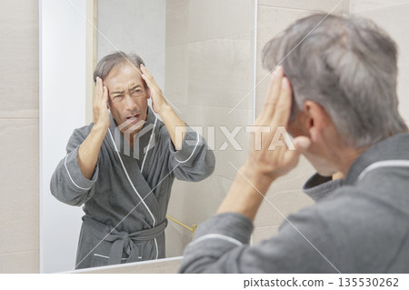Senior man with hair problems Senior man with hair problems 135530262