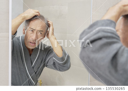Senior man with hair problems Senior man with hair problems 135530265