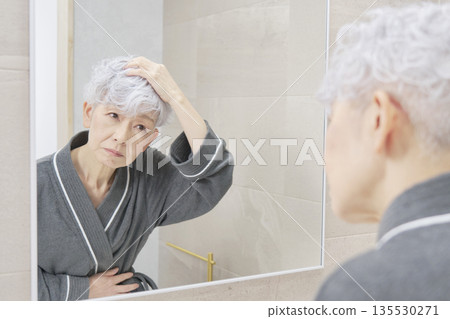 Senior woman with hair problems 135530271