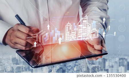 Business growth concept with tablet device, financial graph, and modern city skyline, showcasing innovation, technology, and urban development trends Gluon 135530400