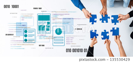 Collaborative Teamwork with Puzzle Pieces and Digital Elements Representing Problem Solving and Innovation in Modern Work Environments Trope 135530429
