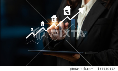 Business Professional Analyzing Real Estate Growth Data on Tablet with Mortgage Percentages and Trend Graph, Concept of Profit and Investment in Property Gantry 135530452