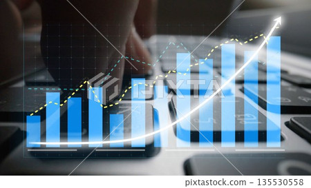 Businessman Working at Laptop with Financial Graphs and Data Analysis, Showing Growth and Success in Market Trends and Investments Copula 135530558