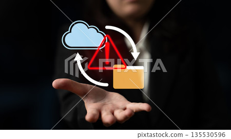 Businessperson presenting cloud computing concepts with warning symbol and data transfer arrows, illustrating technology risk management and digital security Gantry Businessperson presenting cloud computing concepts with warning symbol and data transfer arrows, illustrating technology risk management and digital security Gantry 135530596
