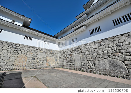 Toyama Castle in Etchu Province: The castle tower, moat, and stone walls on a clear day Toyama Castle in Etchu Province: The castle tower, moat, and stone walls on a clear day 135530798
