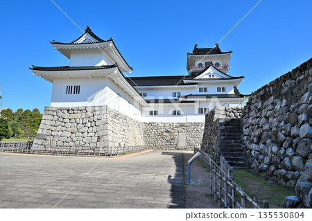 Toyama Castle in Etchu Province: The castle tower, moat, and stone walls on a clear day Toyama Castle in Etchu Province: The castle tower, moat, and stone walls on a clear day 135530804