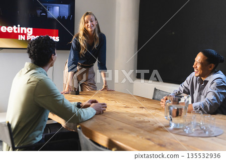 Business professionals discussing ideas during meeting in modern conference room Business professionals discussing ideas during meeting in modern conference room 135532936