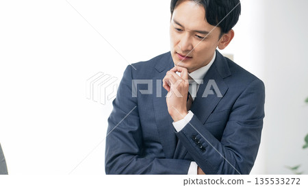 Thinking male business person 135533272
