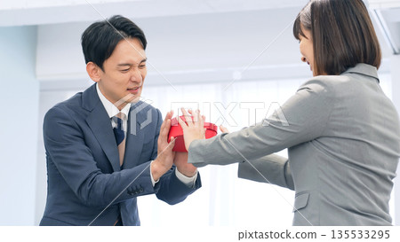 A businessman who refuses a gift 135533295