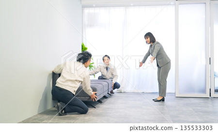 Workers installing furniture 135533303