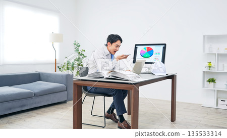 Angry male worker talking on smartphone 135533314