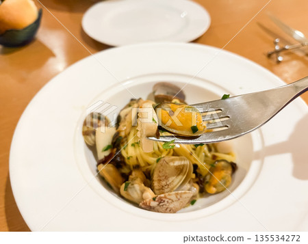 Seafood spaghetti, a pasta dish with clams, mussels, and squid. Seafood spaghetti, a pasta dish with clams, mussels, and squid. 135534272