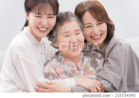 Smiling female three generation family 135534345
