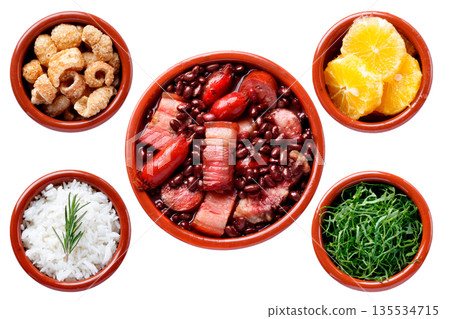 Traditional Brazilian feijoada isolated on a white background, accompanied by white rice, sliced kale, orange and pork crackling in clay bowls Traditional Brazilian feijoada isolated on a white background, accompanied by white rice, sliced kale, orange and pork crackling in clay bowls 135534715