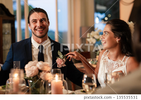 Bride and groom laughing together at elegant wedding reception dinner 135535531