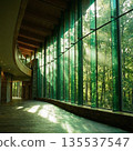 The hall of the building is bathed in sunlight filtering through the trees. 135537547