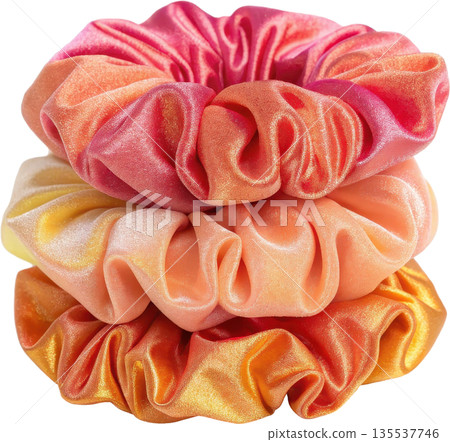 Stack of shiny velvet scrunchies in gradient colors 135537746