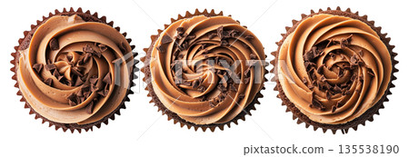 Chocolate cupcake topped with creamy swirled frosting and chocolate shavings, isolated on white background Chocolate cupcake topped with creamy swirled frosting and chocolate shavings, isolated on white background 135538190
