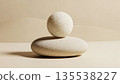 Minimalist art food composition expressing calm emotion, perfectly round rice sphere placed on smooth stone surface 135538227