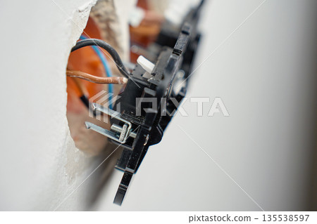 Electrical wall switches with exposed wiring installation 135538597