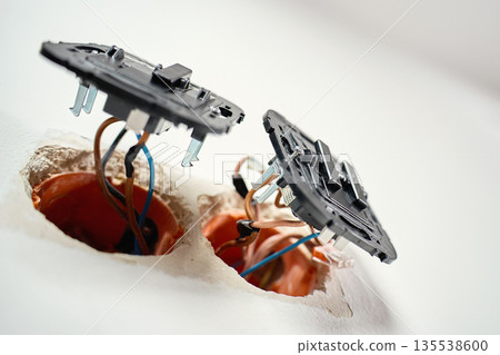 Electrical wall switches with exposed wiring installation 135538600