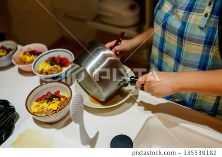 Housewife cooking dinner Housewife cooking dinner 135539182