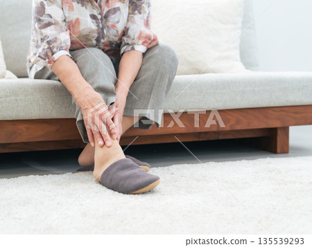 Elderly woman with sore feet Elderly woman with sore feet 135539293