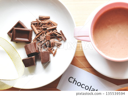 Close-up of a chocolate bar, chopped chocolate and hot chocolate Close-up of a chocolate bar, chopped chocolate and hot chocolate 135539594