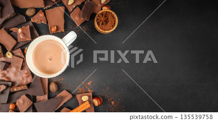 Hot chocolate drink with chocolate pieces and spices top view Hot chocolate drink with chocolate pieces and spices top view 135539758