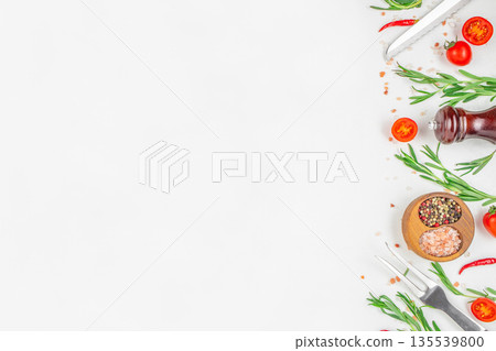Minimal food background with fresh herbs, spices, vegetables and kitchen utensils arranged on white surface with copy space Minimal food background with fresh herbs, spices, vegetables and kitchen utensils arranged on white surface with copy space 135539800