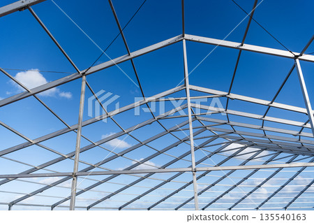 Structural design engineering. Structure engineering at building site. Framework construction architecture. Architectural detail. Installation of metal structure. Metal construction backdrop Structural design engineering. Structure engineering at building site. Framework construction architecture. Architectural detail. Installation of metal structure. Metal construction backdrop 135540163