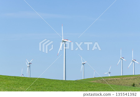 A wind power plant towering over a hill (image of natural energy) A wind power plant towering over a hill (image of natural energy) 135541392