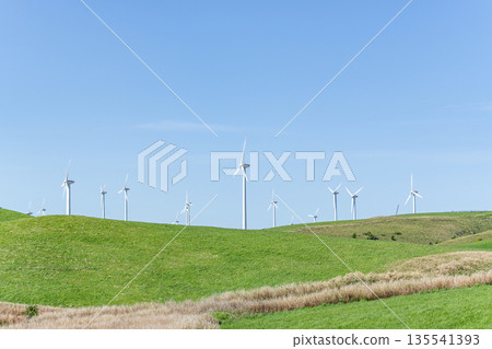 Wind power plant towering over a hill (image of natural energy) 135541393