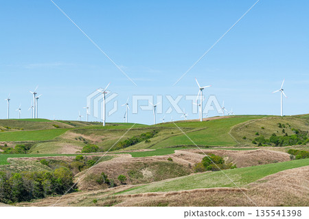 A wind power plant towering over a hill (image of natural energy) A wind power plant towering over a hill (image of natural energy) 135541398